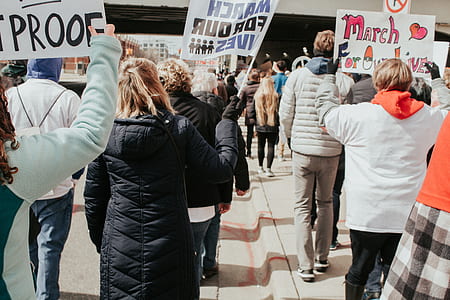group of people holding signages thumbnail