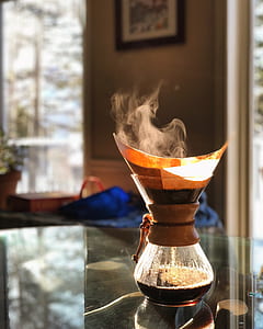selective focus photography of smoking glass jar on top of glass table thumbnail