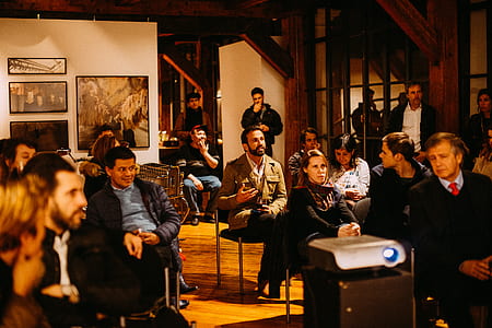 group of people inside area filled with artworks thumbnail