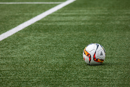 white adidas soccer ball on green grass thumbnail