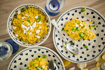 Risotto with broad bean on a cute plate with blue hearts thumbnail