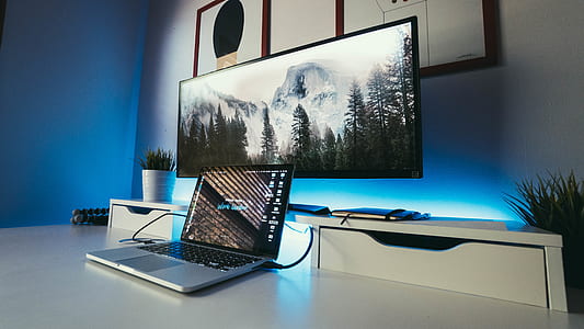photo of turn-on laptop computer on desk thumbnail