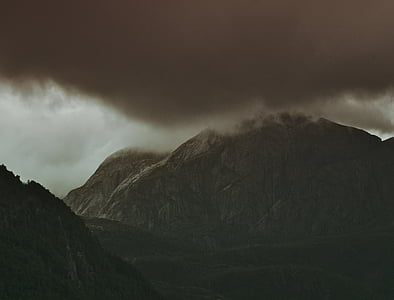 black mountain covered with clouds thumbnail