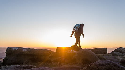 man standing on rock formations thumbnail