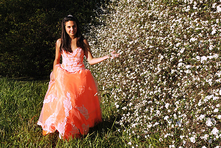 woman standing beside white petaled flowers thumbnail