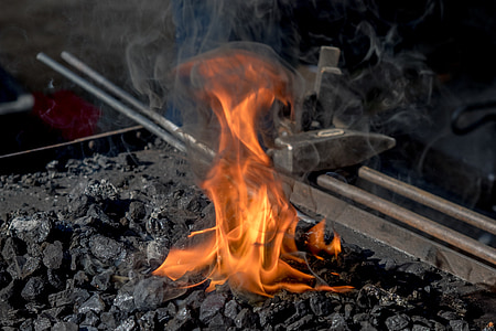 charcoal with flame near black metal tool thumbnail