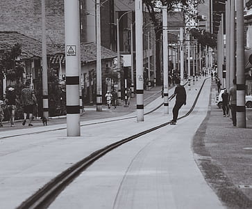 grayscale photography of man playing skateboard thumbnail