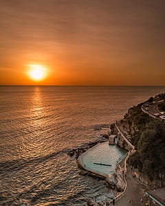 Scenic View Of Ocean During Sunset thumbnail