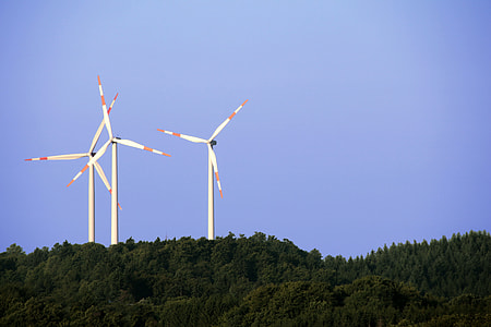 three white windmills during daytime thumbnail
