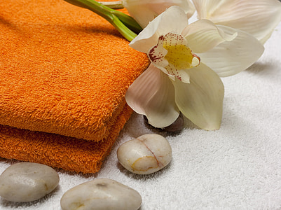 white orchids on orange fleece towel thumbnail