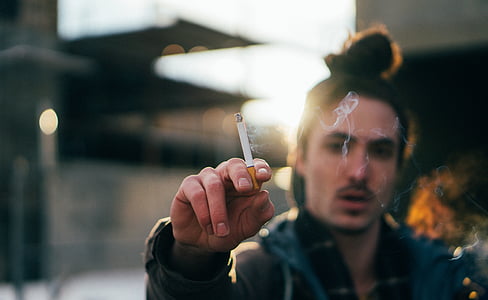 man holding disposable cigarette thumbnail