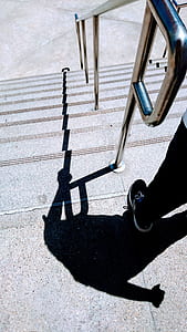person standing near handrails thumbnail