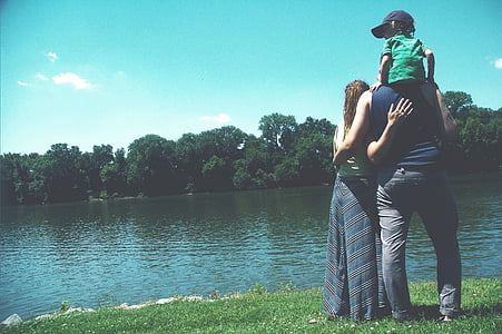 man carrying boy wearing cap thumbnail