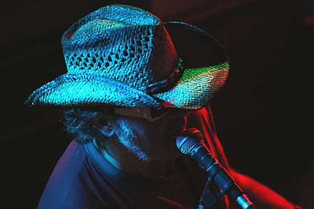 man wearing tan straw cowboy hat and sunglasses singing thumbnail