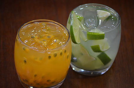 two clear rocks glasses filled with liquid thumbnail