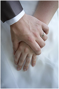 groom and bride holding hands thumbnail