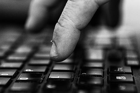 person pressing keyboard buttons thumbnail