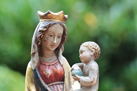 religious female character carrying child statuette thumbnail