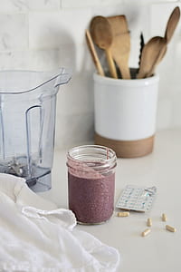 clear glass jar beside electric blender thumbnail