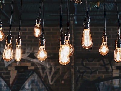 selective focus photo of orange hanging lights thumbnail