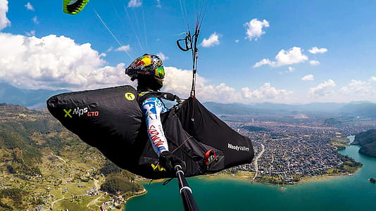 person paragliding through the sky thumbnail