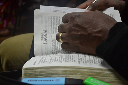 person holding book thumbnail