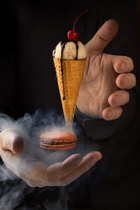 closeup of person's hand beside floating ice cream thumbnail