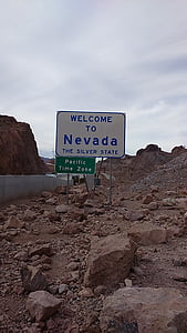 Welcome to Nevada The Silver State board signage near rocks thumbnail
