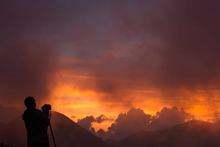 silhouette of person holding camera thumbnail