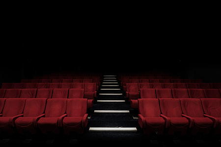 empty theater seats with dim light thumbnail