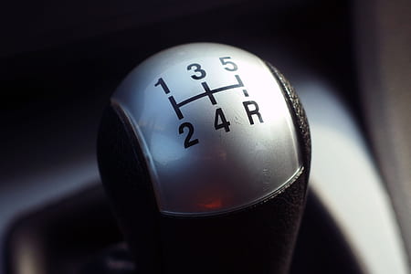 closeup photography of black and gray vehicle gear shift lever thumbnail