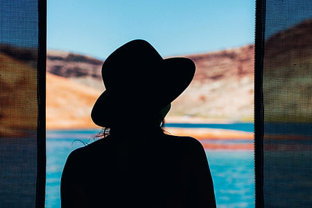 silhouette of woman wearing hat thumbnail