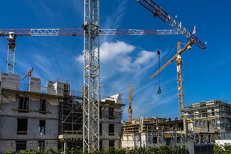 crane near under-construction building thumbnail