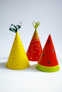 three assorted-color party hats thumbnail