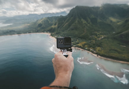 person holding action camera thumbnail