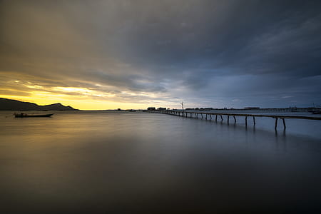 river dock under gray sky thumbnail