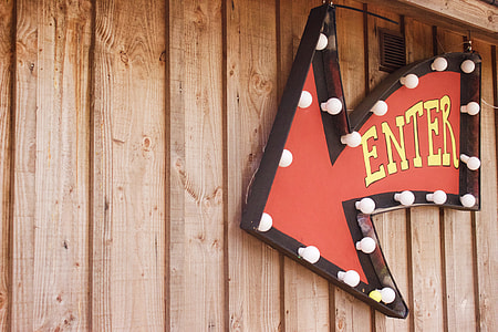 red and brown arrow sign marquee thumbnail