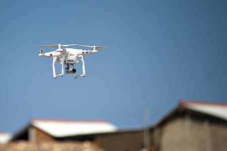 white and black quadcopter drone thumbnail