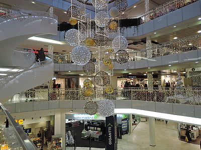 gold and silver chandelier beside spiral stairs thumbnail