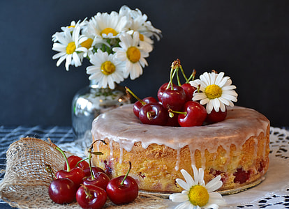 cherry fruits and white flowers on table thumbnail