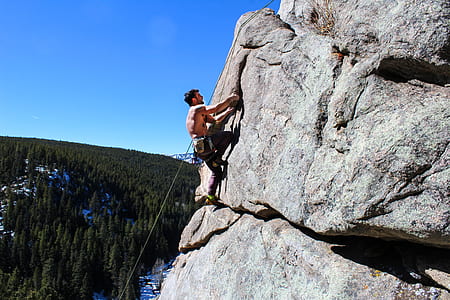 man rappelling on top on mountain thumbnail