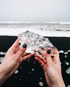 person holding crystal stone thumbnail