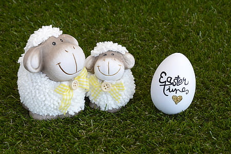 two white lamb figurines and white egg thumbnail