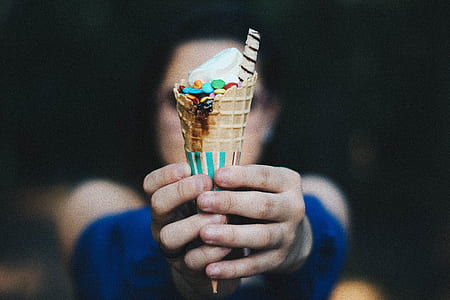 person holding vanilla ice cream with cone thumbnail