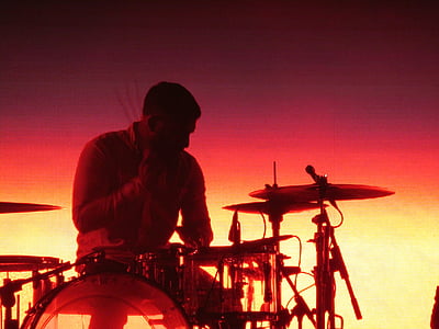 man sitting on drum set thumbnail