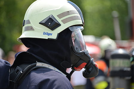 person wearing white and black gas mask thumbnail