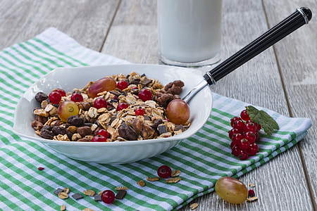 white ceramic bowl filled with cereals and fruit thumbnail