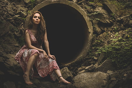 woman sitting on gray rock thumbnail