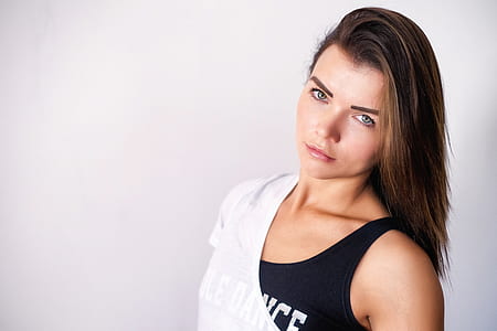 woman wearing white shirt and black tank top thumbnail