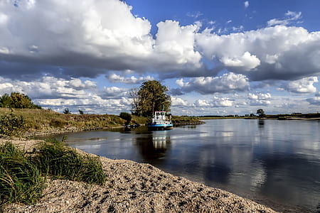 boat near shoreline during daytime thumbnail
